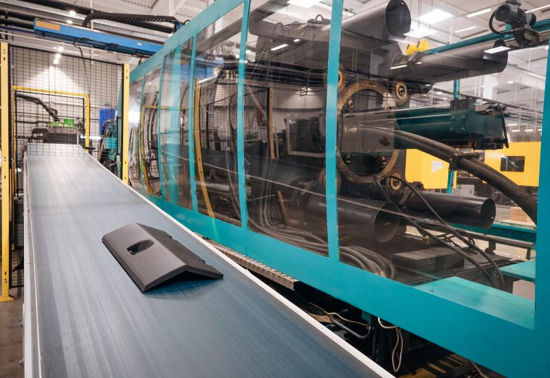 Automotive plastic part produced using plastic molding equipment in the USA